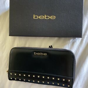 NWOT Bebe Black zipped with gold trim wallet with box